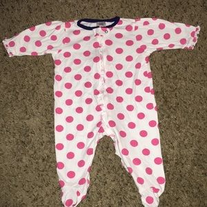 White onesie with polka dots